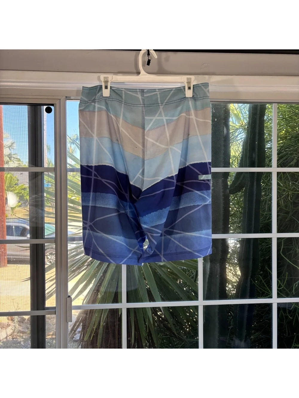 Blue striped Huk board shorts